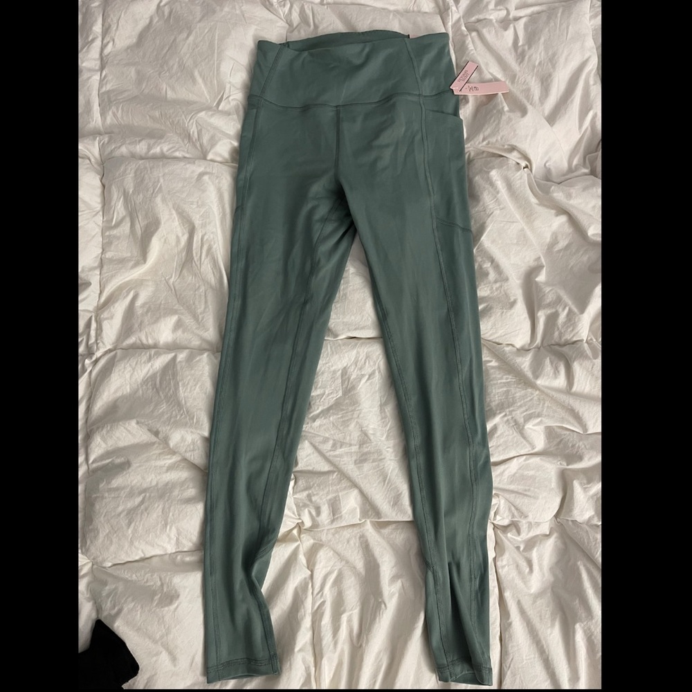 NWT. Victoria’s Secret green leggings. Never worn. Size 6